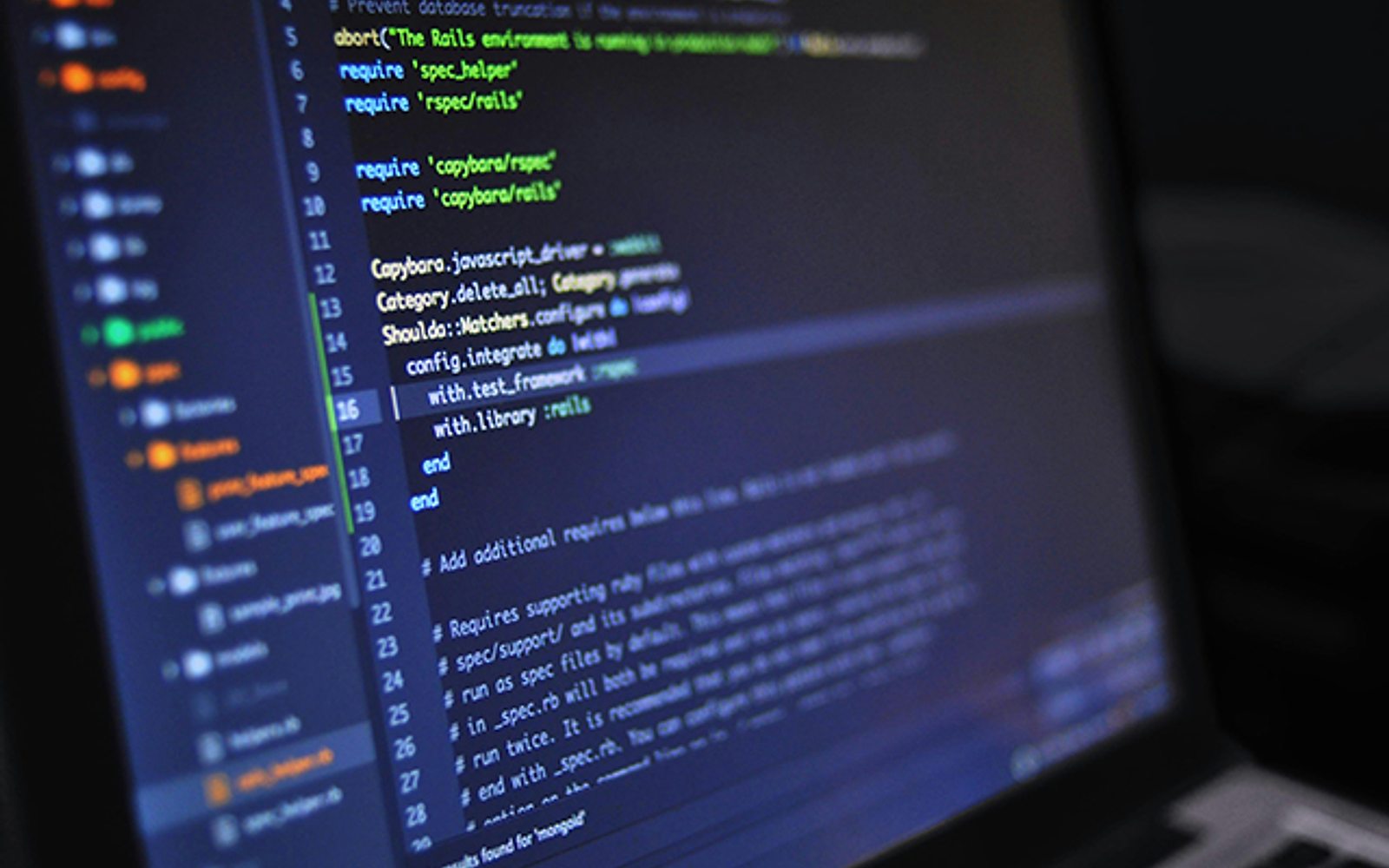 A laptop screen showing code in an editor
