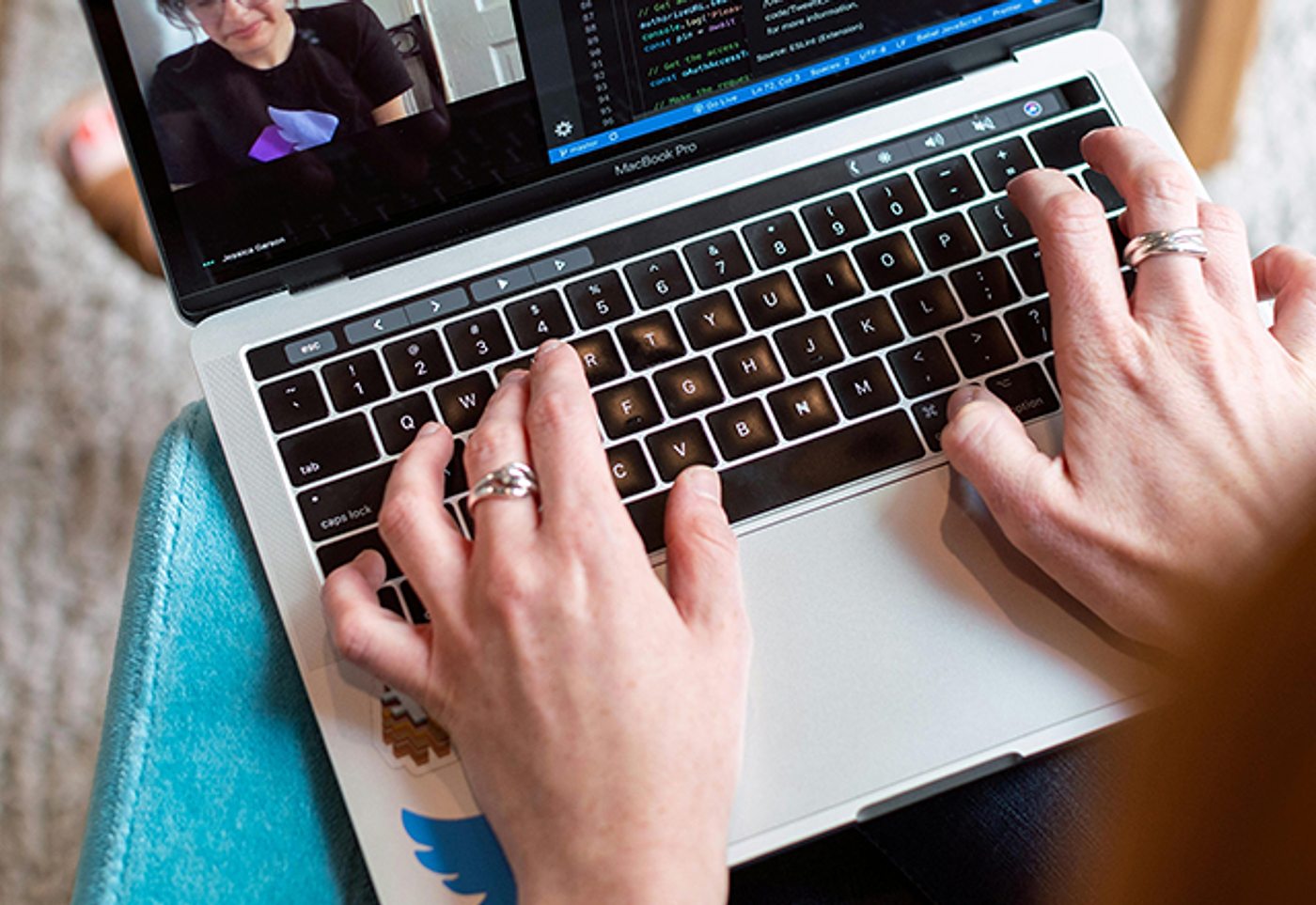 Hands on a laptop keyboard during a video call